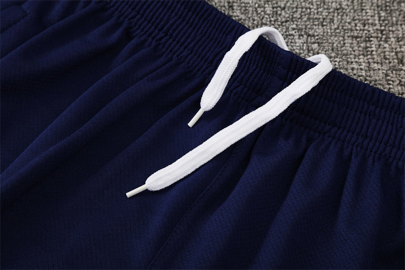 Tenue maillot + short Barcelone bleu foncé/orange 25/26