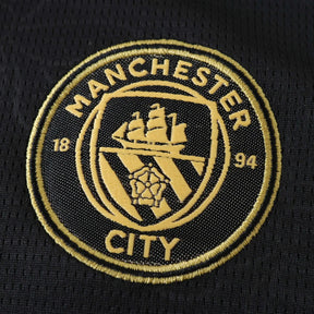 Maglia Manchester City Away 26/27 Donna Nero con dettagli oro | Maglia da Calcio