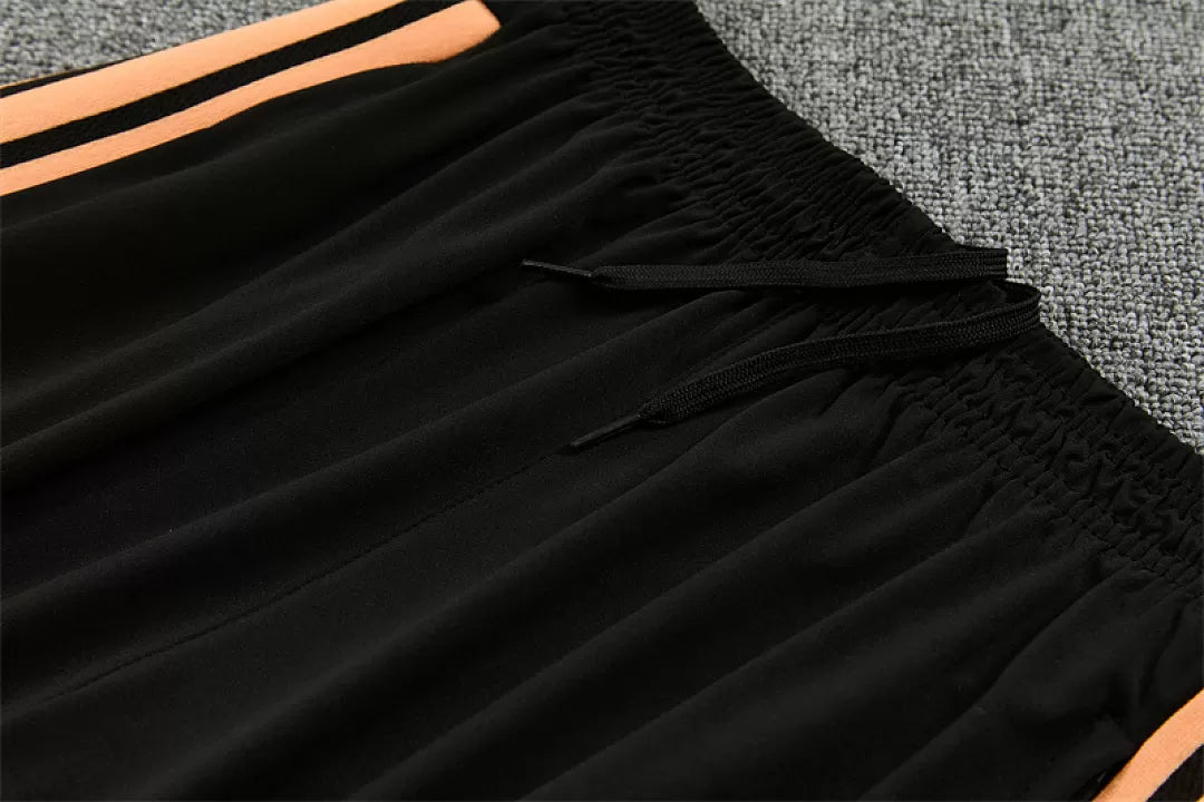 Tuta Arsenal 26/27 Uomo Nero con dettagli Arancione | Maglia da Calcio
