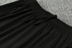 Tuta Barcelona 26/27 Uomo Nero con dettagli Viola e Giallo | Maglia da Calcio