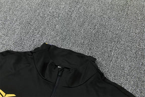 Tuta Barcelona 26/27 Uomo Nero con dettagli Viola e Giallo | Maglia da Calcio